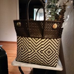 A plastic woven tote bag